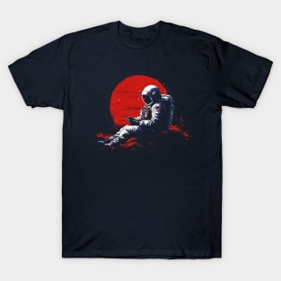 astronaut with a mobile phone sitting on the top of a hill T-Shirt